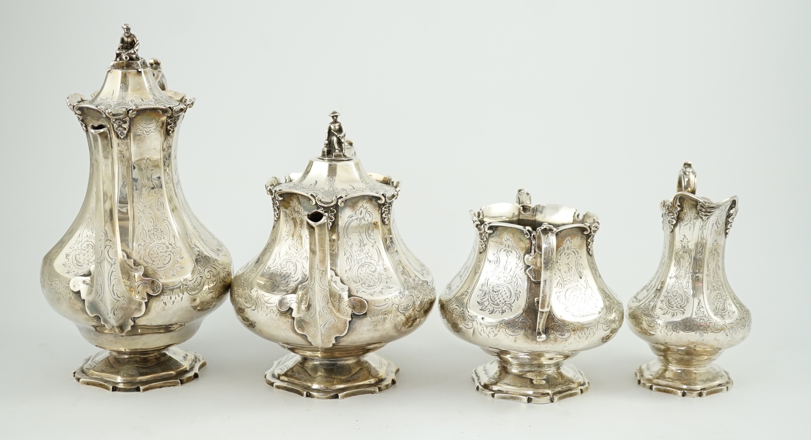 A Victorian silver pedestal four piece tea and coffee service by Robert Harper